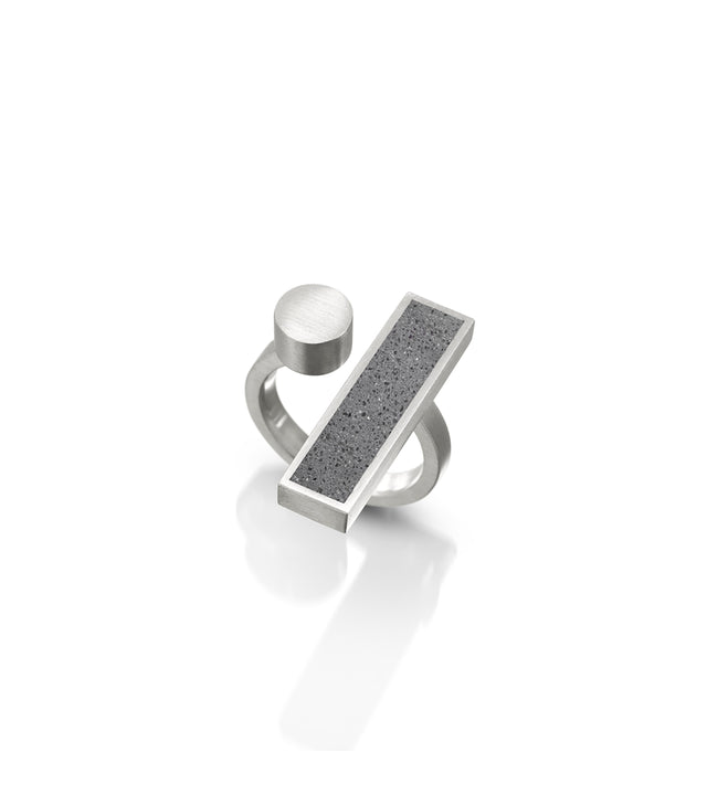 A concrete and stainless steel ring, part of the Elements Collection, Alma ring, inspired by Bauhaus ethos of design and craftsmanship.	