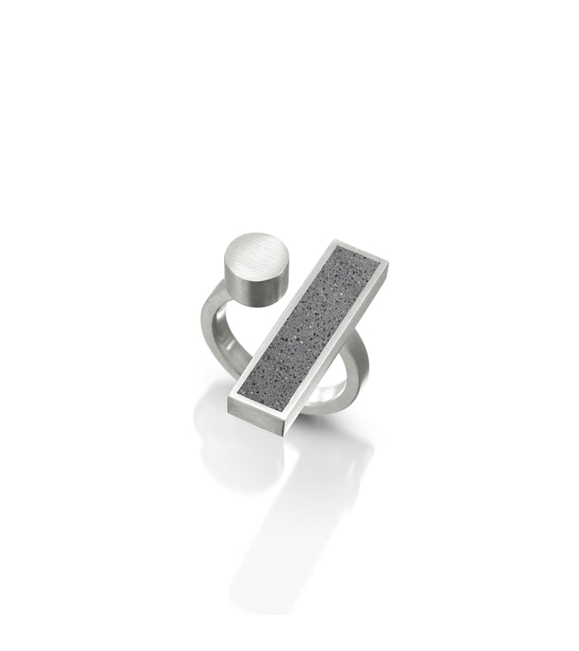 A concrete and stainless steel ring, part of the Elements Collection, Alma ring, inspired by Bauhaus ethos of design and craftsmanship.