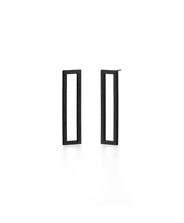 a pair of black powder coated long rectangular studs from the KONZUK Artus collection