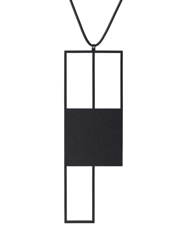 Black powder coated stainless steel sculptural statement necklace with a rubber cord