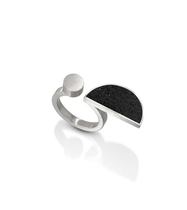 The Dorte ring captures the spirit of Dorte Helm's geometric textile designs and is a modern homage to the Bauhaus ethos. Like Dorte's commitment to striking patterns, these rings seamlessly merge simple geometry with everyday elegance, offering a contemporary expression of the Bauhaus tradition in concrete and stainless steel.