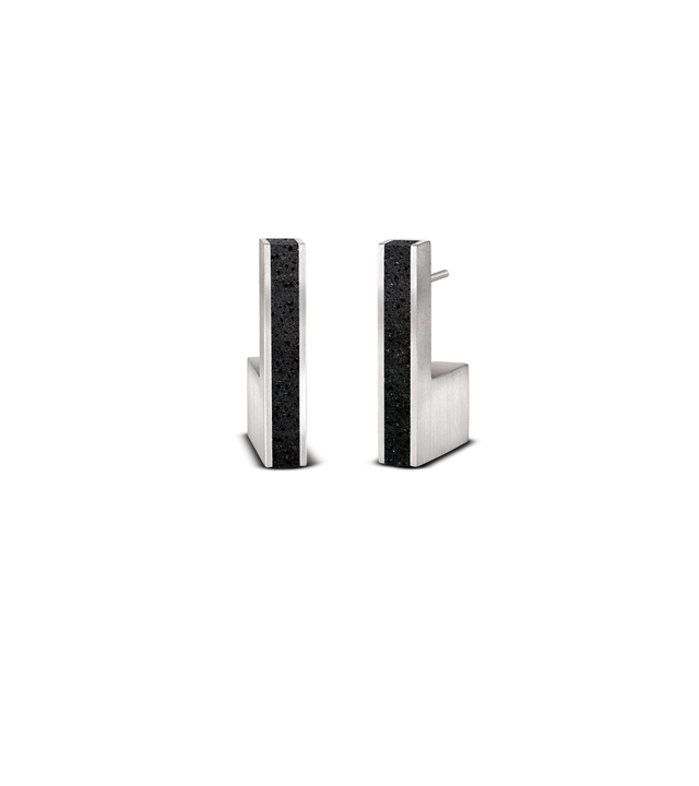 Unique geometric stainless steel earrings with rectangular inlays of black concrete, inspired by Bauhaus modernist design principles.s minimalist design principles