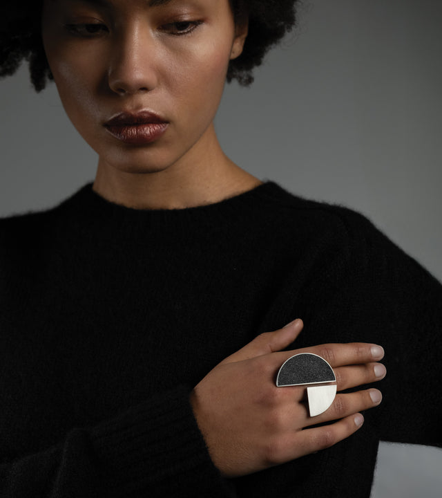 Channelling the avant-garde legacy of László Moholy-Nagy at the Bauhaus, KONZUK's Elements, Nagy rings echo his commitment to geometric precision and the fusion of art with technology. Crafted from concrete and stainless steel, these rings embody Moholy-Nagy's spirit, offering a contemporary interpretation that seamlessly merges innovation, abstraction, and wearable artistry.