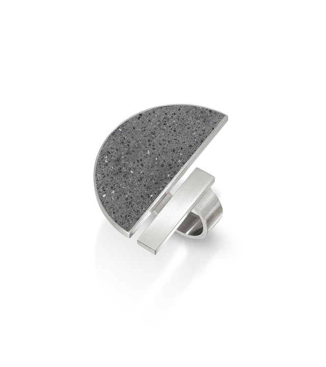 Inspired by Georg Muche's Bauhaus legacy, Elements, Georg rings celebrate simplicity and geometric elegance. With concrete and stainless steel, these rings embody Muche's geometric abstractions, merging art and technology in contemporary designs that echo the Bauhaus spirit of innovation and aesthetic refinement.