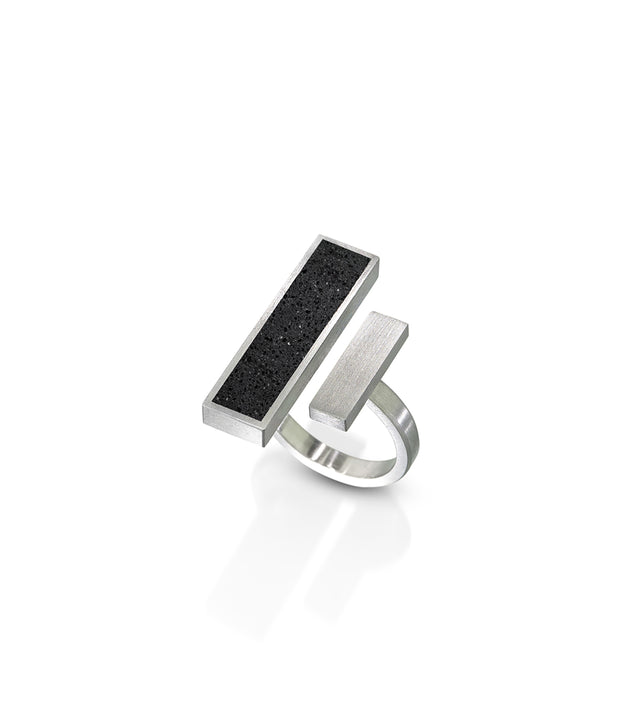 Walter Gropius' groundbreaking design philosophy at the Bauhaus, emphasizing the fusion of art, craftsmanship, and technology, profoundly influences KONZUK's Elements rings. Gropius ring, inspired by his vision, embodies geometric precision and modern aesthetics, showcasing a seamless integration of concrete and stainless steel that echoes the Bauhaus commitment to innovative, functional design.