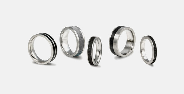 Group of concrete and stainless steel wedding rings. 