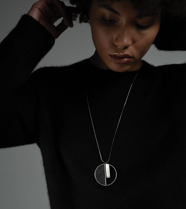 Bauhaus inspired diamond dust-and-concrete necklace. Influenced by the works of designer Georg Muche.
