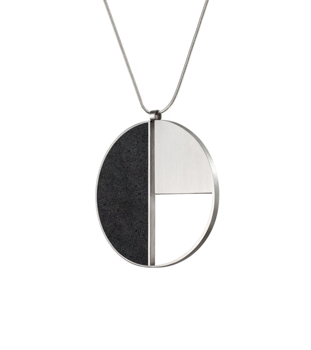 KONZUK's Elements Nagy necklace pays homage to László Moholy-Nagy's Bauhaus style with concrete and stainless steel, merging innovation and wearable artistry.