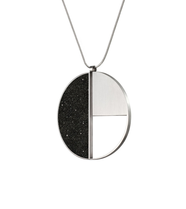 KONZUK's Elements Nagy necklace pays homage to László Moholy-Nagy's Bauhaus style with diamond dust concrete and stainless steel, merging innovation and wearable artistry.