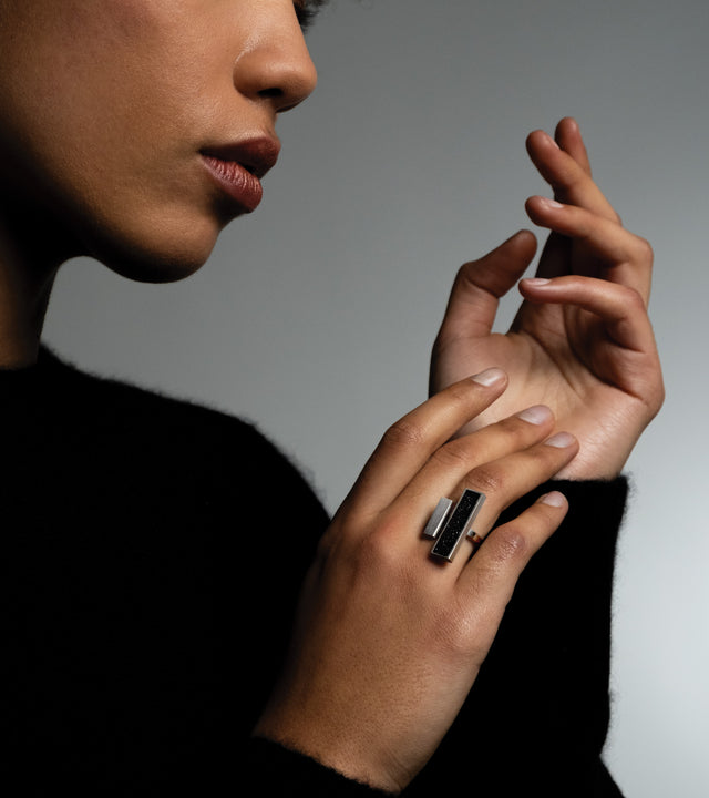 Walter Gropius' groundbreaking design philosophy at the Bauhaus, emphasizing the fusion of art, craftsmanship, and technology, profoundly influences KONZUK's Elements rings. The Gropius ring, inspired by Gropius' vision, embodies geometric precision and modern aesthetics, showcasing a seamless integration of concrete and stainless steel that echoes the Bauhaus commitment to innovative, functional design.