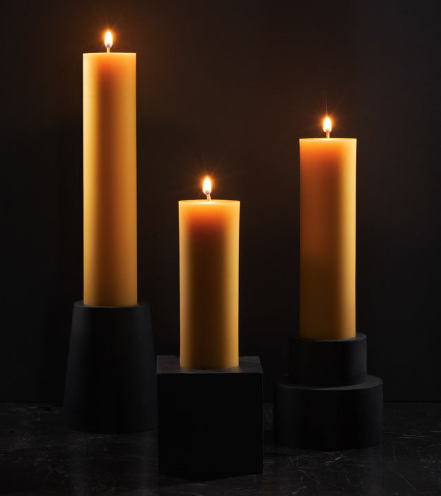 brutalist concrete candle holders with natural beeswax pillar candle from the KONZUK Monument collection
