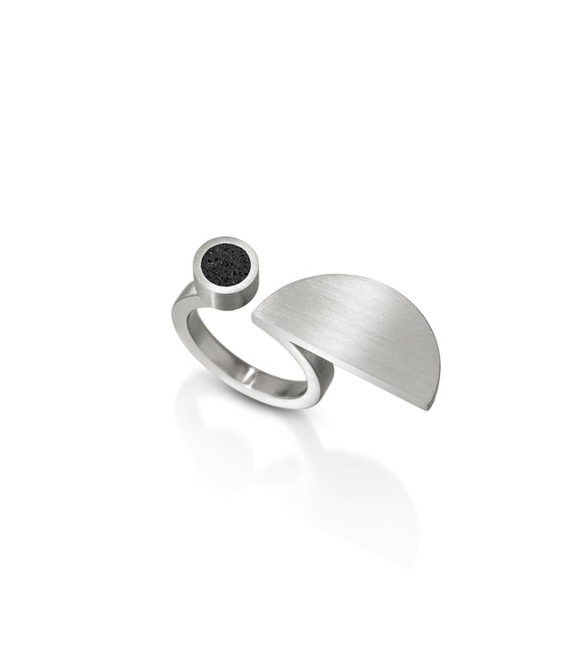 Step into the visual legacy of Lucia Moholy with KONZUK's Lucia rings, where concrete and stainless steel combine in geometric perfection. Much like Moholy's lens captured the essence of Bauhaus design, these rings encapsulate the movement's spirit, translating it into contemporary, wearable art that echoes the precision and innovation of the Bauhaus era.
