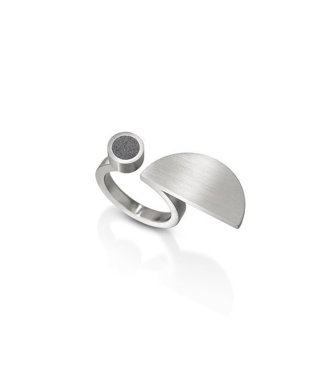 Step into the visual legacy of Lucia Moholy with KONZUK's Lucia rings, where concrete and stainless steel combine in geometric perfection. Much like Moholy's lens captured the essence of Bauhaus design, these rings encapsulate the movement's spirit, translating it into contemporary, wearable art that echoes the precision and innovation of the Bauhaus era.