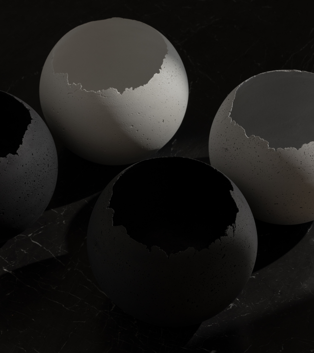 Group of extra-large concrete vessels in four different colors.