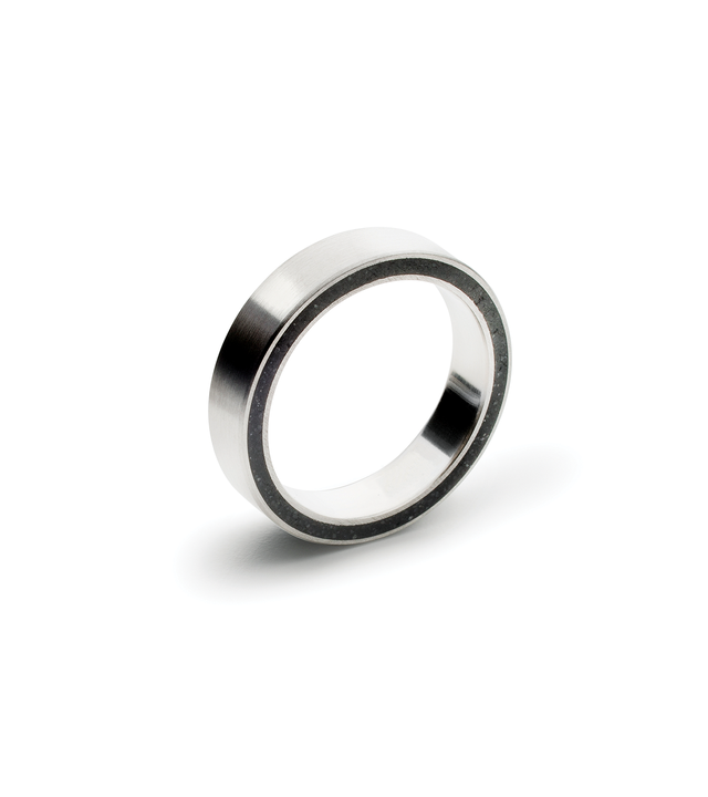 Minimalist stainless steel band designed with black concrete cast into the side.