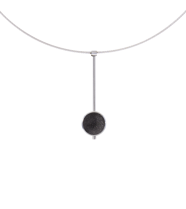 The Inspira Minor necklace feature authentic diamond dust embedded into a concrete lined stainless steel dome architecturally positioned onto a suspended minimalist steel post.