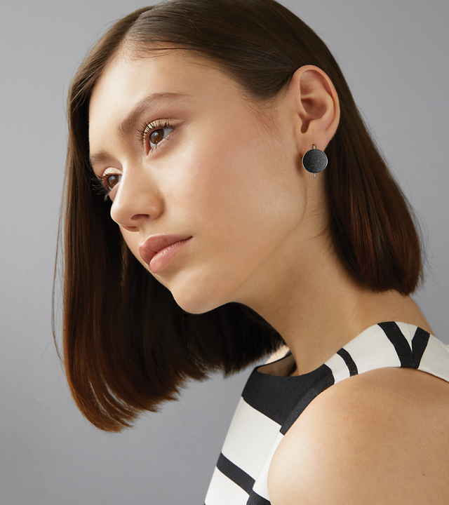 Bauhaus inspired Juno earrings sparkle with diamond dust and black concrete lined stainless steel or 14k gold dome a minimalist steel or gold post.