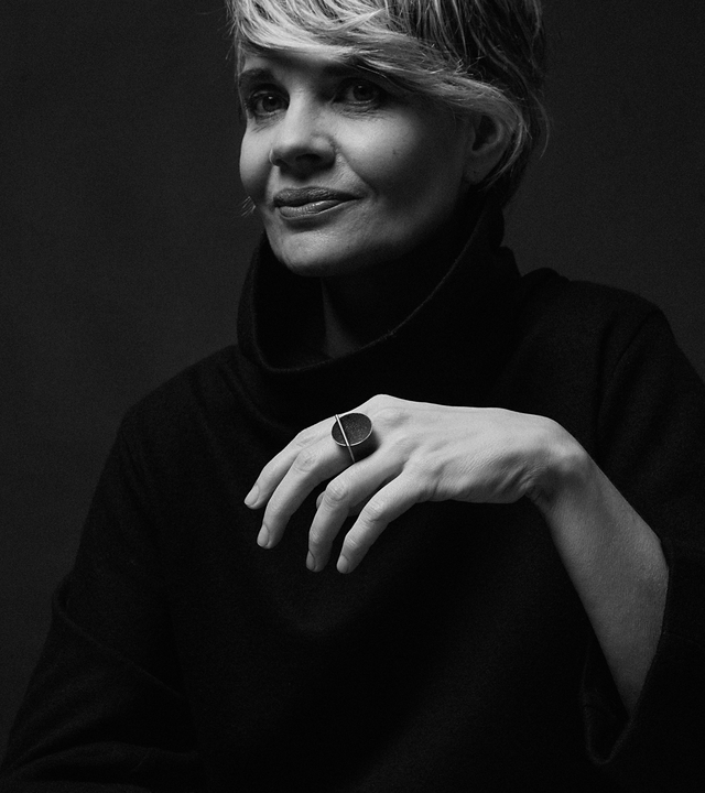 Diamond dust sparkles from inside a concrete lined stainless steel dome suspended from a minimalist square steel ring.