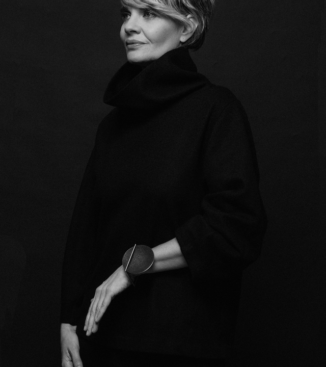 Frama Max bracelet is Bauhaus design inspired jewelry featuring diamond dust infused black concrete set into a larger stainless steel dome suspended from a square steel frame.