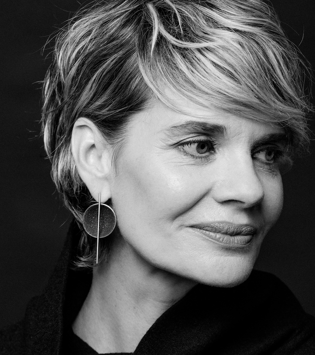 Bauhaus design inspired earrings featuring concrete and diamond dust set into a stainless steel dome suspended architecturally from a small steel post.