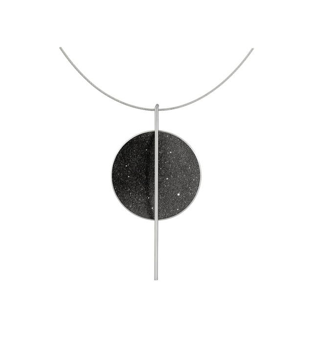 The bauhaus inspired Linnea Major necklace sparkles with diamond dust and black concrete set into a stainless steel dome suspended onto an intersecting steel post.