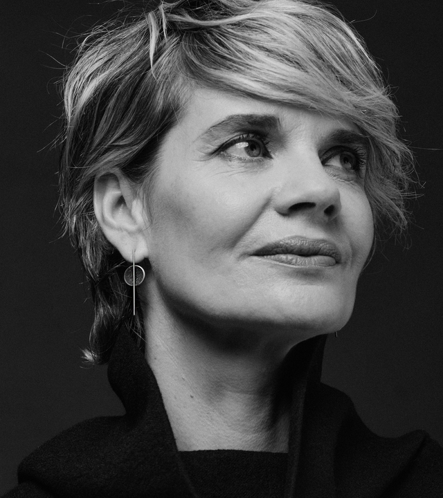 Linnea Minor earrings are Bauhaus design inspired jewelry featuring concrete and diamond dust set into a stainless steel dome suspended from a vertical steel post.