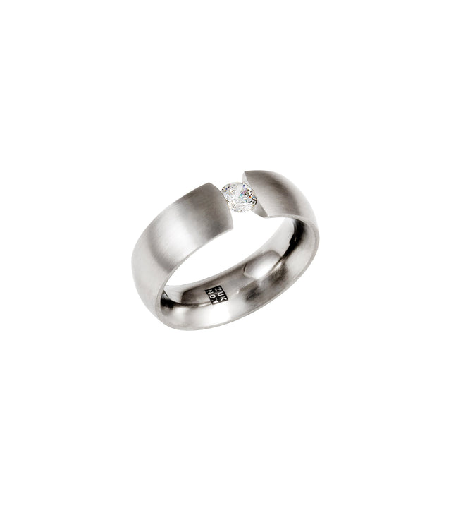 A .25ct Canadian diamond engagement ring with a curved band, suspended in a tension set, with a brushed finish on the outside and polished inside.