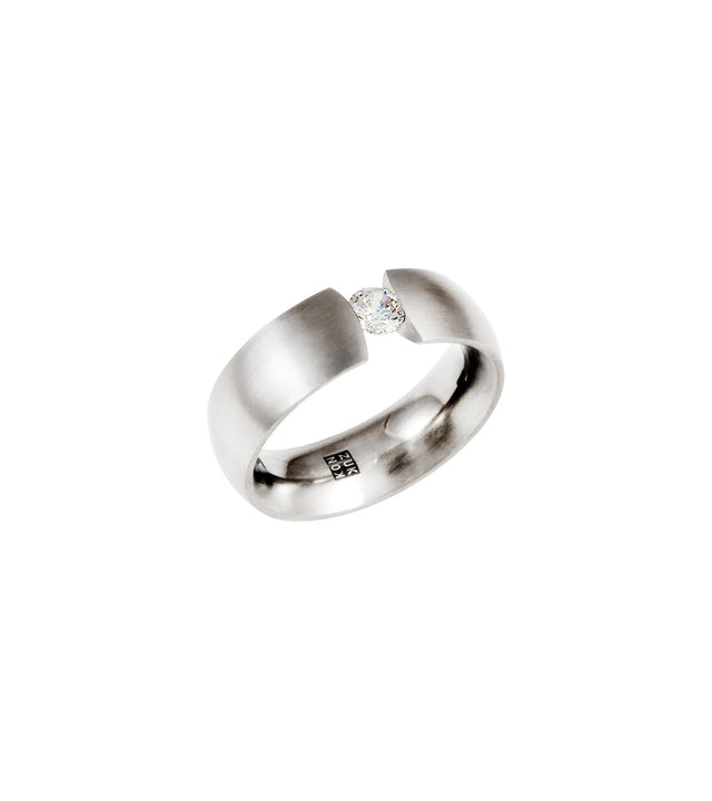 A .25ct Canadian diamond engagement ring with a curved band, suspended in a tension set, with a brushed finish on the outside and polished inside.