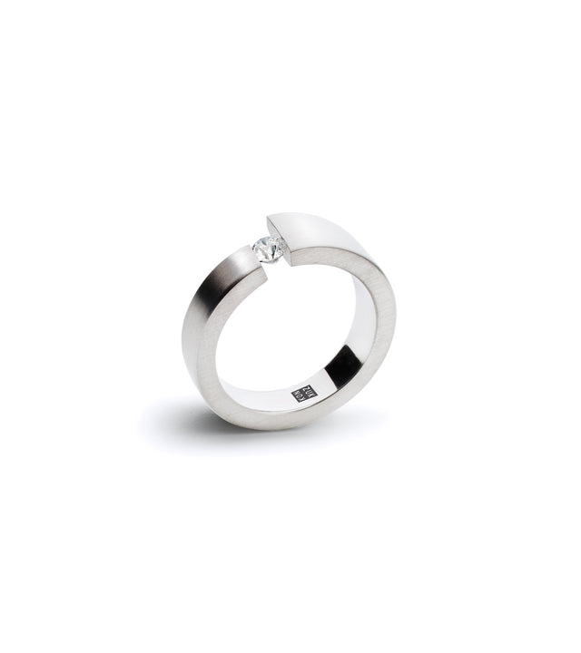 a platinum engagement ring holds a .1ct diamond suspended between two bands