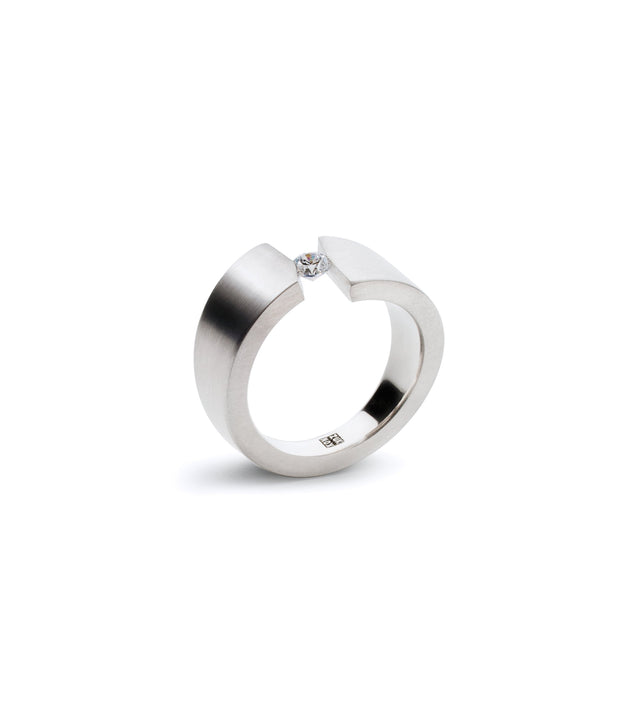 a sculptural diamond ring made in platinum