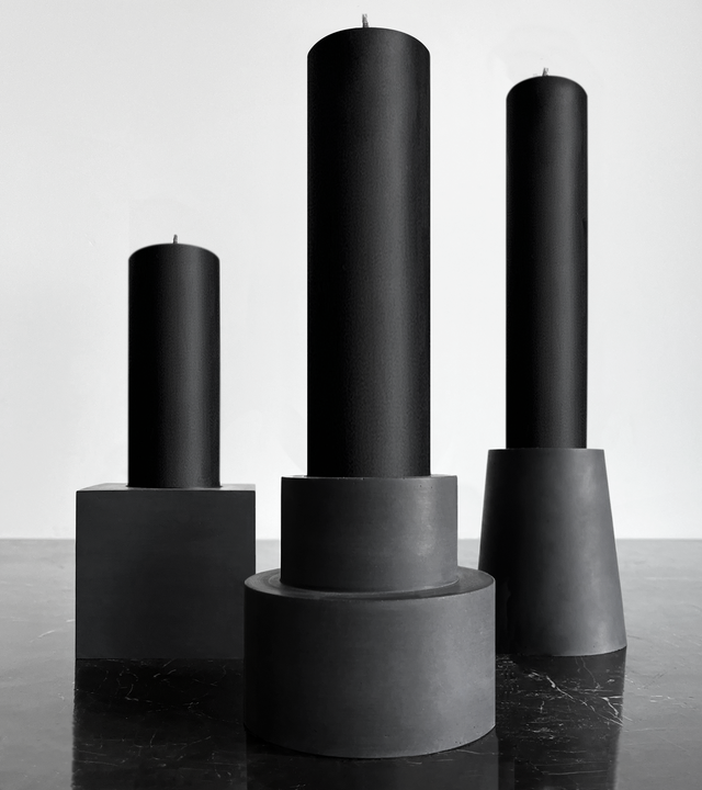 brutalist monumental sized black concrete candle holders with black beeswax pillar candles