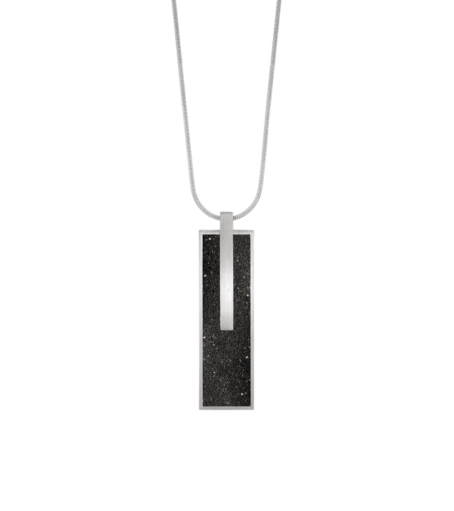 Memento Beholden locket with diamond dust concrete set into rectangular stainless steel framework.