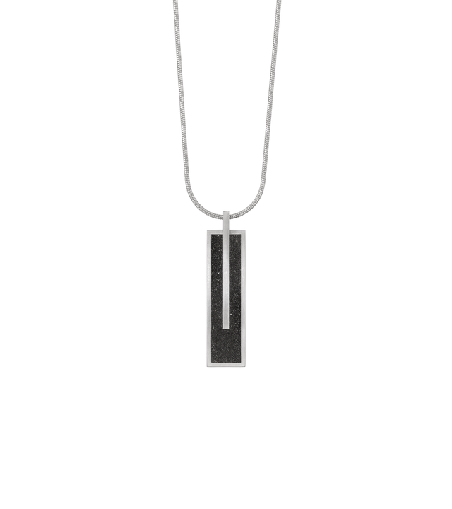 Memento Beholden pendent with diamond dust encrusted concrete set into small rectangular stainless steel design.