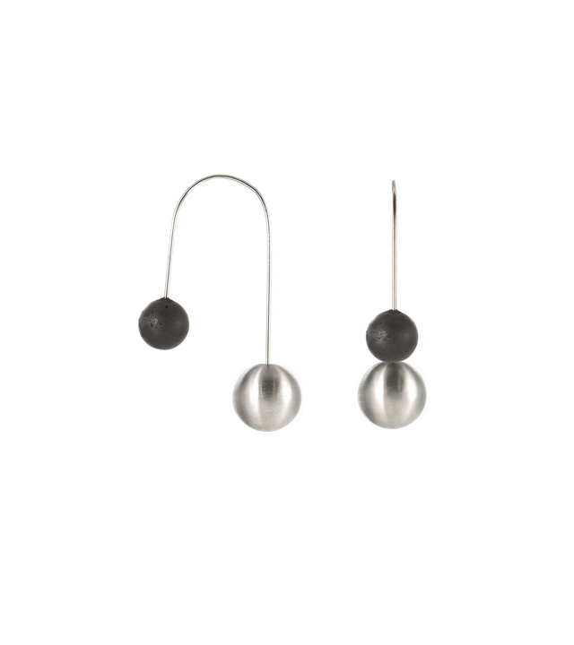 Centauri earrings balance concrete with stainless steel minimalist geometric forms.