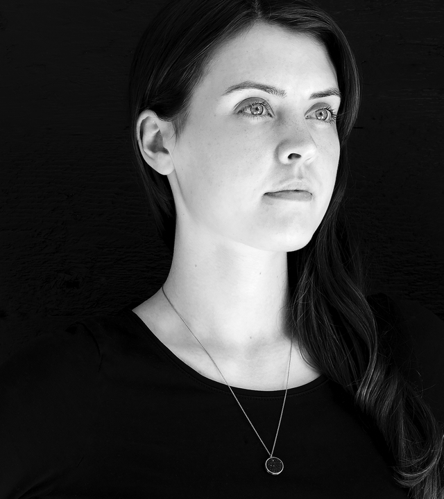 Maia Minor concrete necklace set with diamond dust inside a minimalist stainless steel geometric form hanging centred from an elegant linked chain.