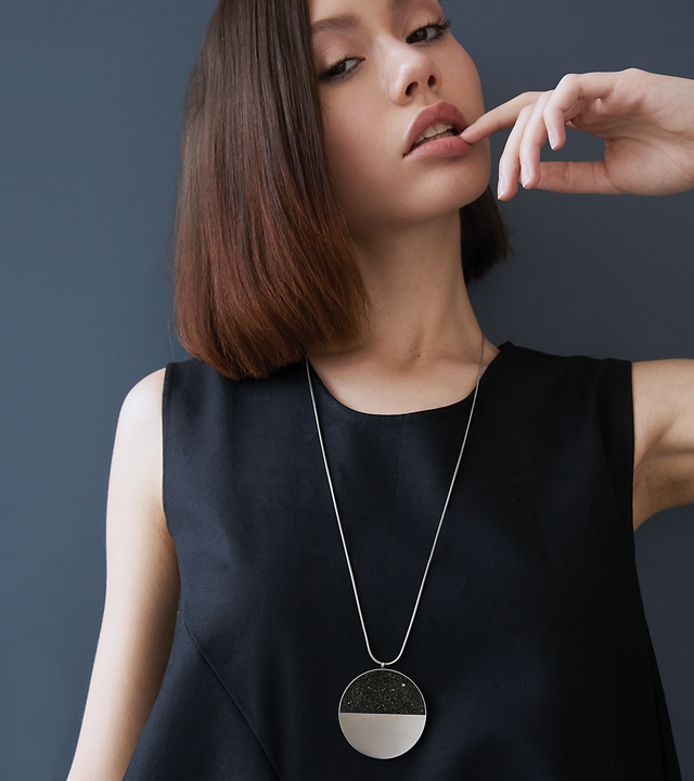 Stellar statement necklace sparkles with diamond dust infused concrete echoing the infinite night sky.