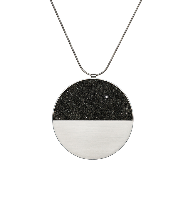 The larger sized Mira Major concrete and diamond dust necklace achieves minimalist beauty with modernist jewelry design that echoes architectural principles of balance, rhythm and harmony.