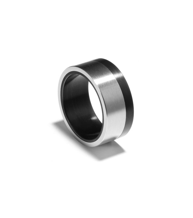 A chunky black and silver stainless steel wedding ring with PVD coating.