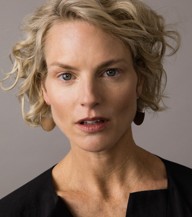 Model with thin stainless steel Umbra earrings.