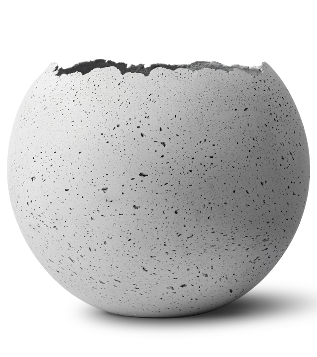 Hand-crafted concrete vessel with a live-edge opening, in a natural gray color.