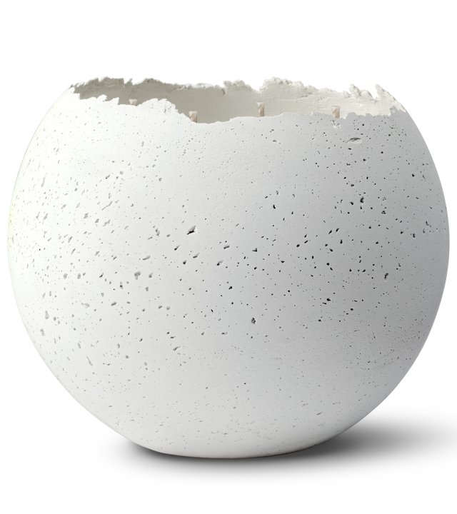 Hand-poured white concrete candle with a rough texture and a 4-wick design, depicting the candle's container after the wax has burned away.