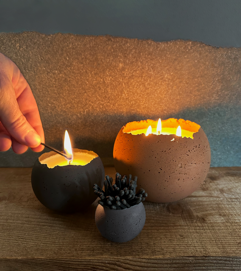 Concrete candles with matches.