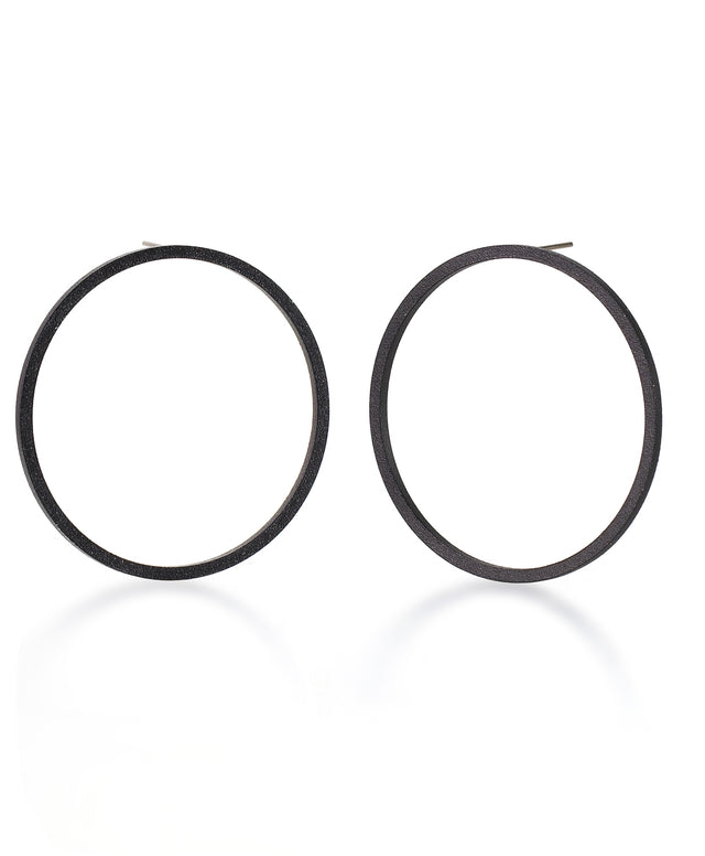 a simple yet bold pair of statement hoop earrings of black powder coated stainless steel from the KONZUK Artus collection.