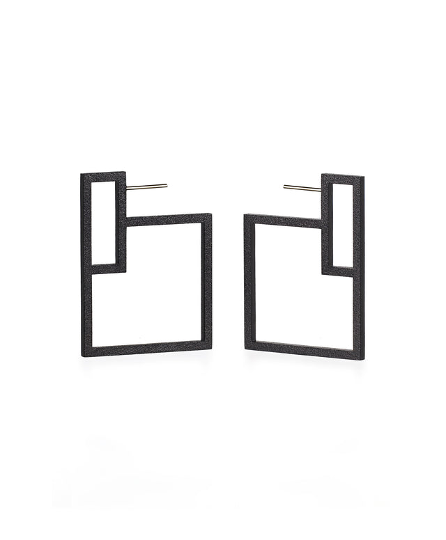 Pair of black geometric earrings from the KONZUK Artus collection