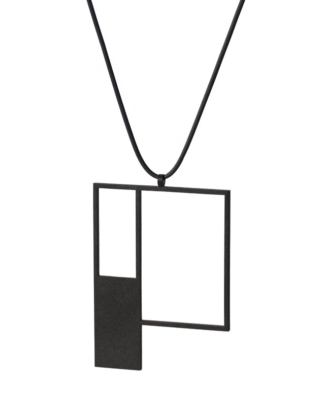 side view of minimalist sculptural black powder coated necklace with a square geometric form from the Artus collection of KONZUK