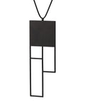A large rectangular black sculptural necklace from the KONZUK Artus collection called Ratio Rp6 side view