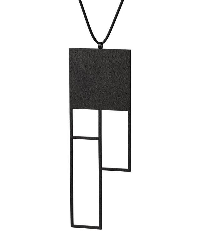 A large rectangular black sculptural necklace from the KONZUK Artus collection called Ratio Rp6 side view
