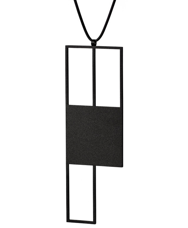 Black powder coated stainless steel sculptural statement  necklace with a rubber cord from the Artus collection called Ratio Rp7