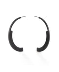statement semi circular black hoop earrings on a white background