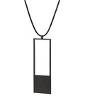 side view of a black minimalist rectangular geometric necklace with a rubber cord from the KONZUK Artus collection Sp2
